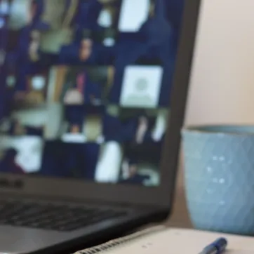 picture of laptop with people at an online class