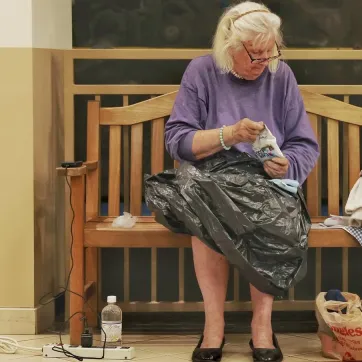 woman charging phone and recharging at YMCA of Western NC's Reuter Family YMCA