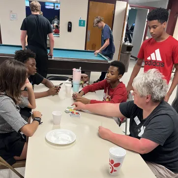 teens gathered with YMCA staff for a teen night